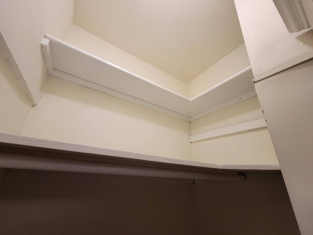 Added a high shelf in a bedroom closet to expand s