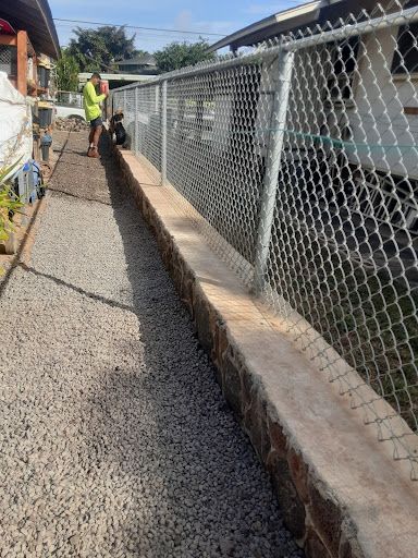 Rock Wall, Chain Link Fence, & Gravel Installation