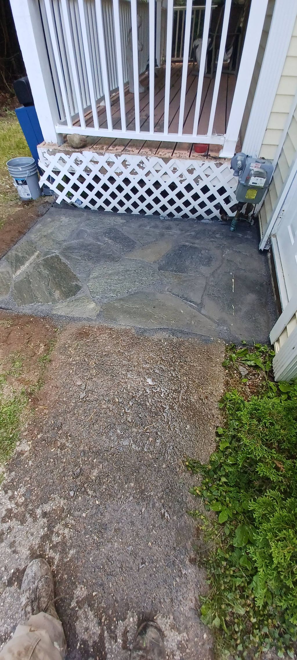 Small step patio in front of side door to prevent 