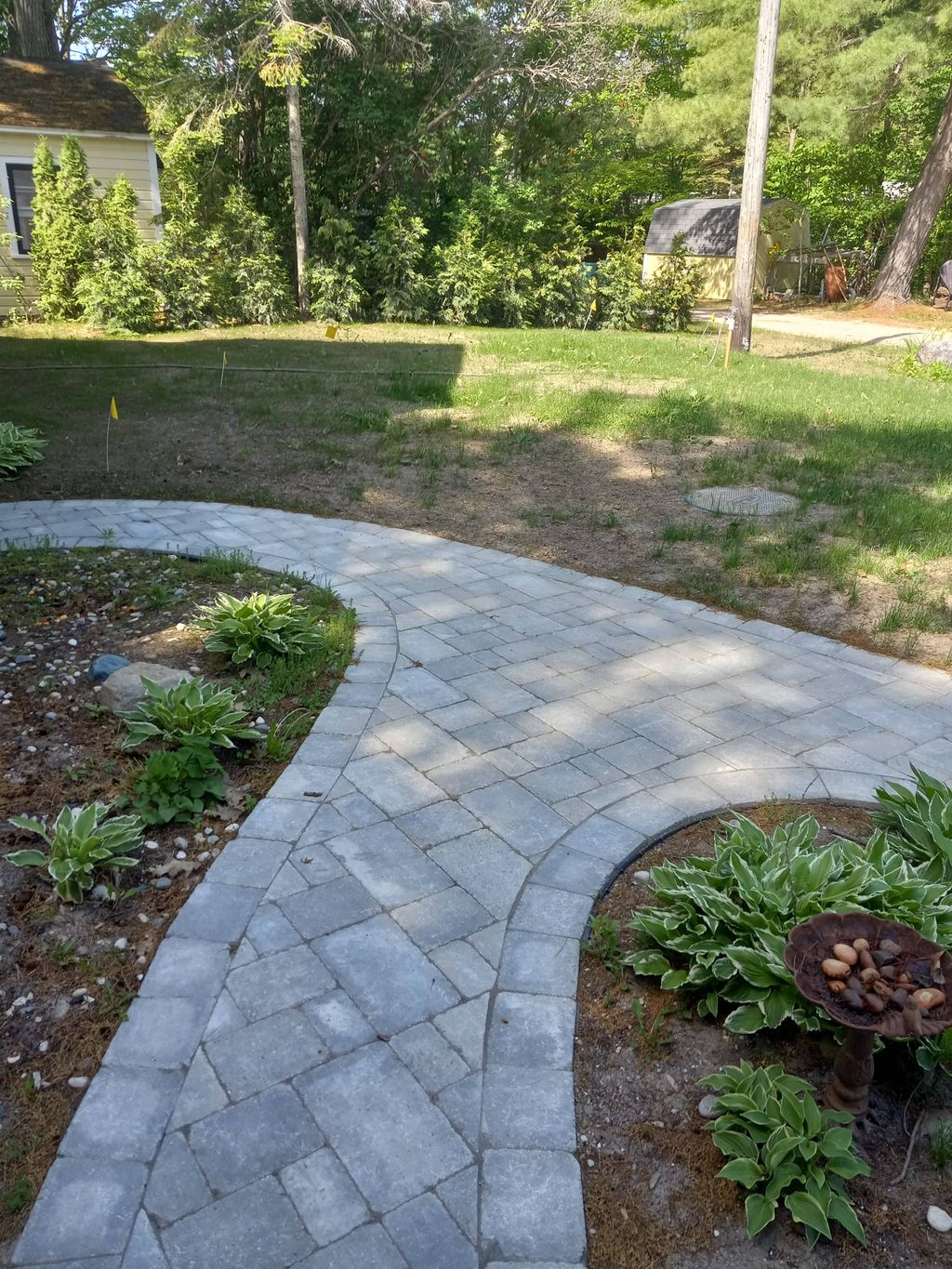 curved walkway to meet front door, garage side doo