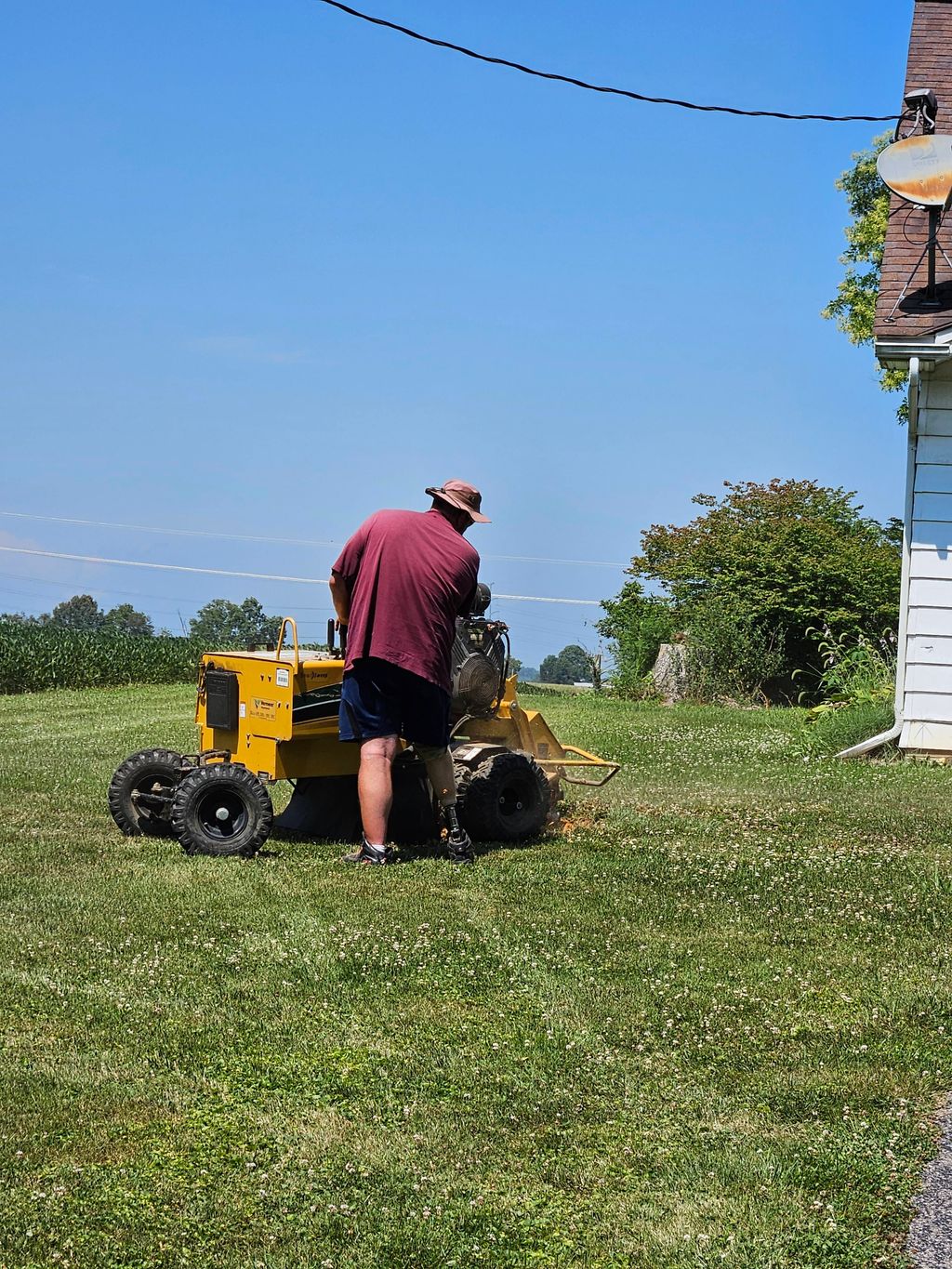Here crew member is grinding off a stump!