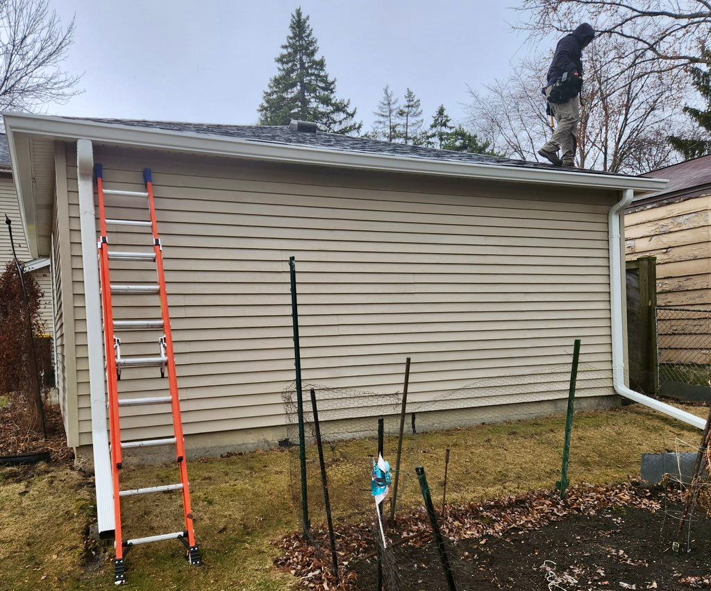 AFTER: New 6” gutters installed on four sides of g