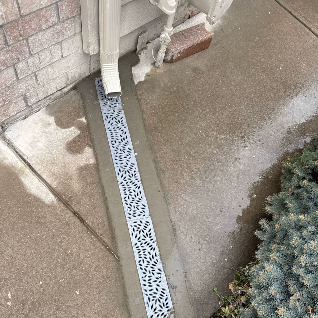 Concrete cut and drain installed in the sidewalk o