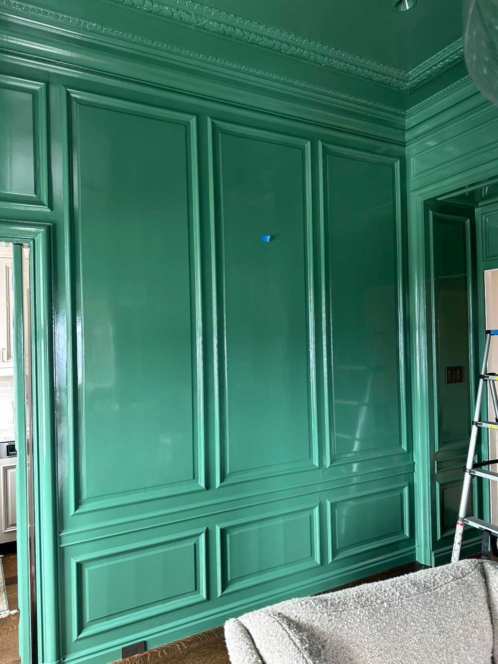 Wall prepped with precision—laser leveled, taped, 