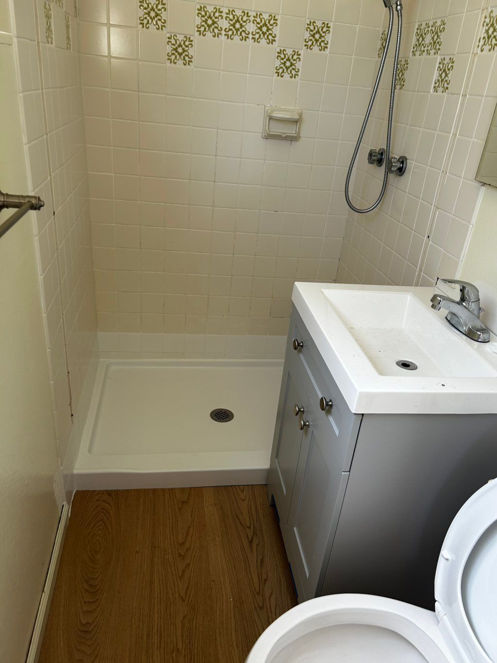 Installed new shower vanity and flooring