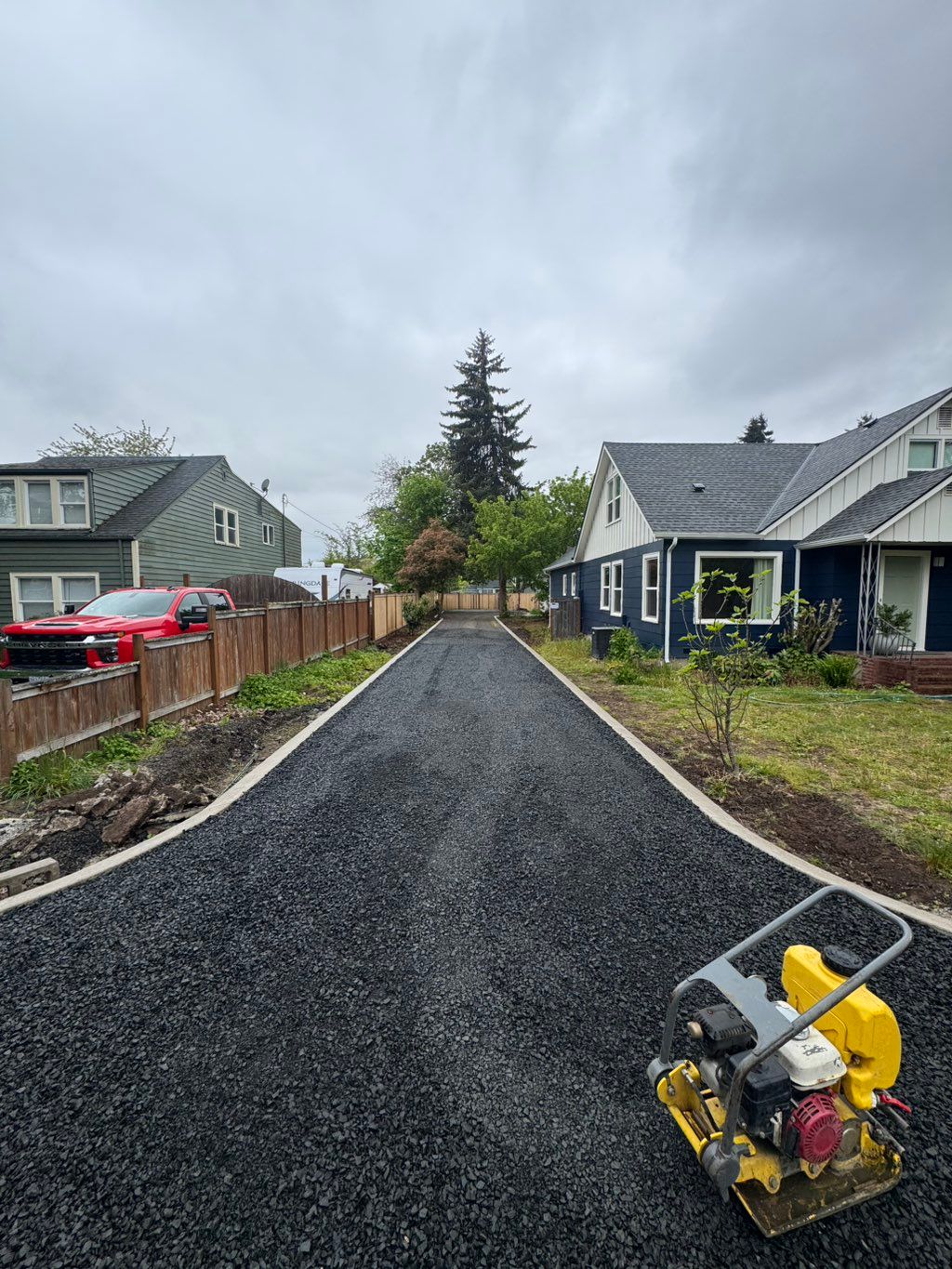 New gravel driveway with concrete boarders 