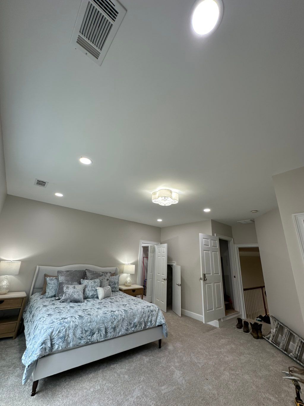 After adding the can lights, ceiling fan and furni