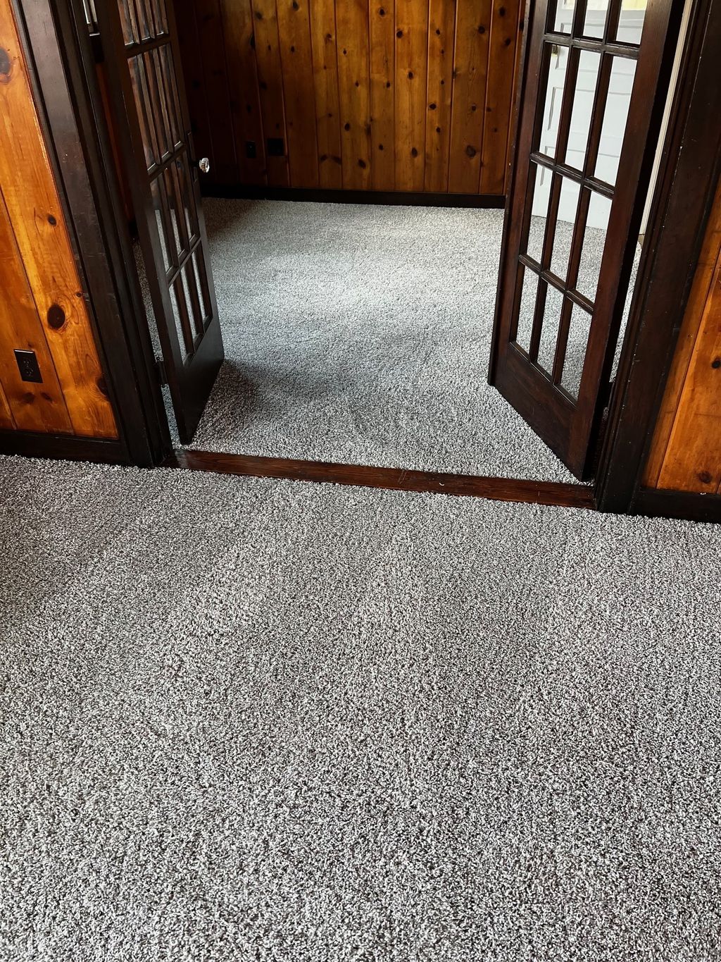 Before (2) of a grey carpet installation.