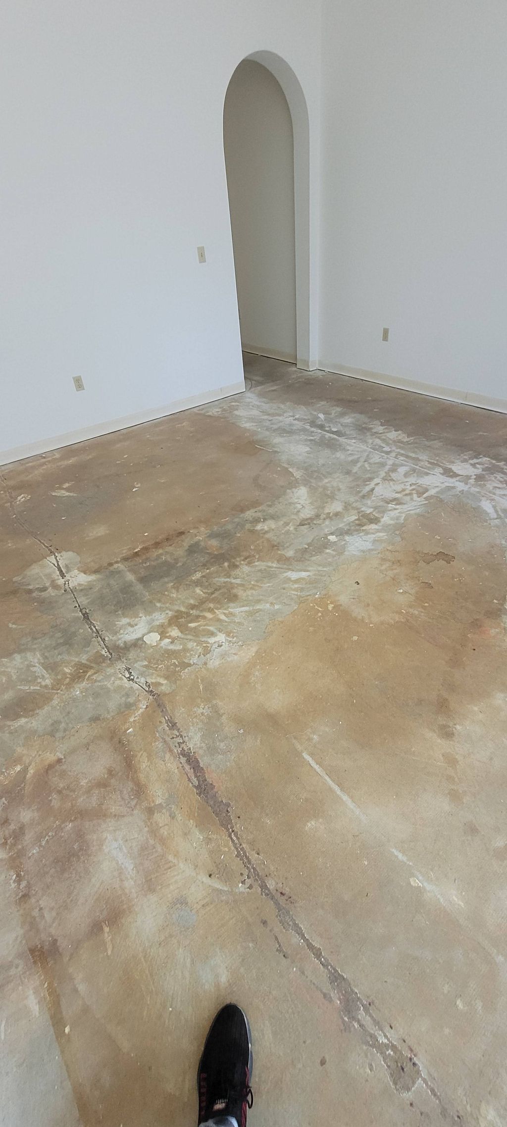 Before: Bare floor ready to have porcelain tile in