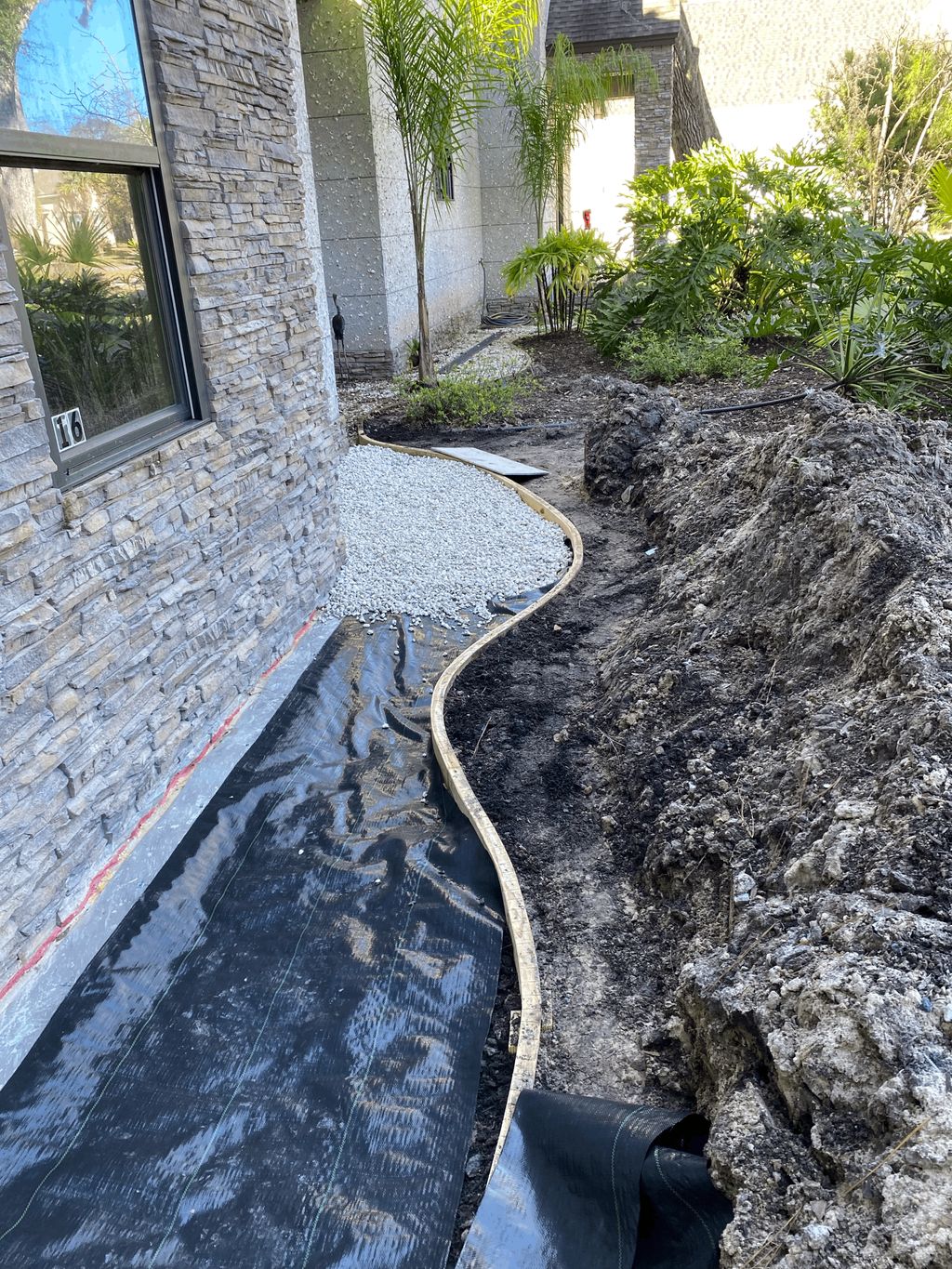 Hardscape with white rock and boarder board