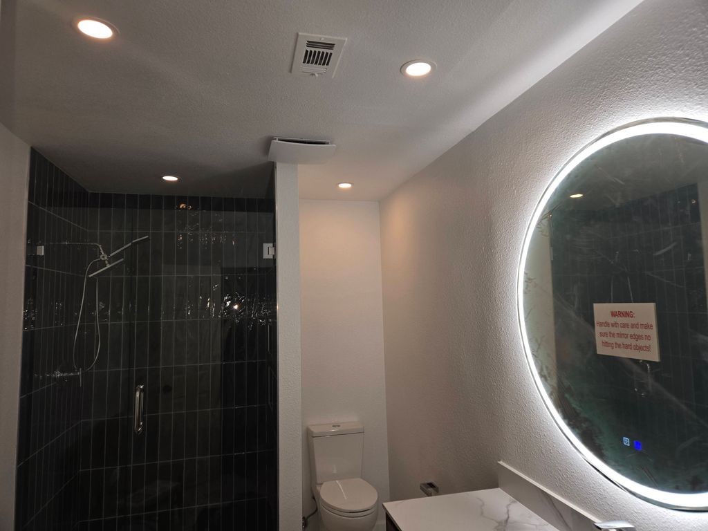 New lighting, fan, lighted mirror, outlets and swi