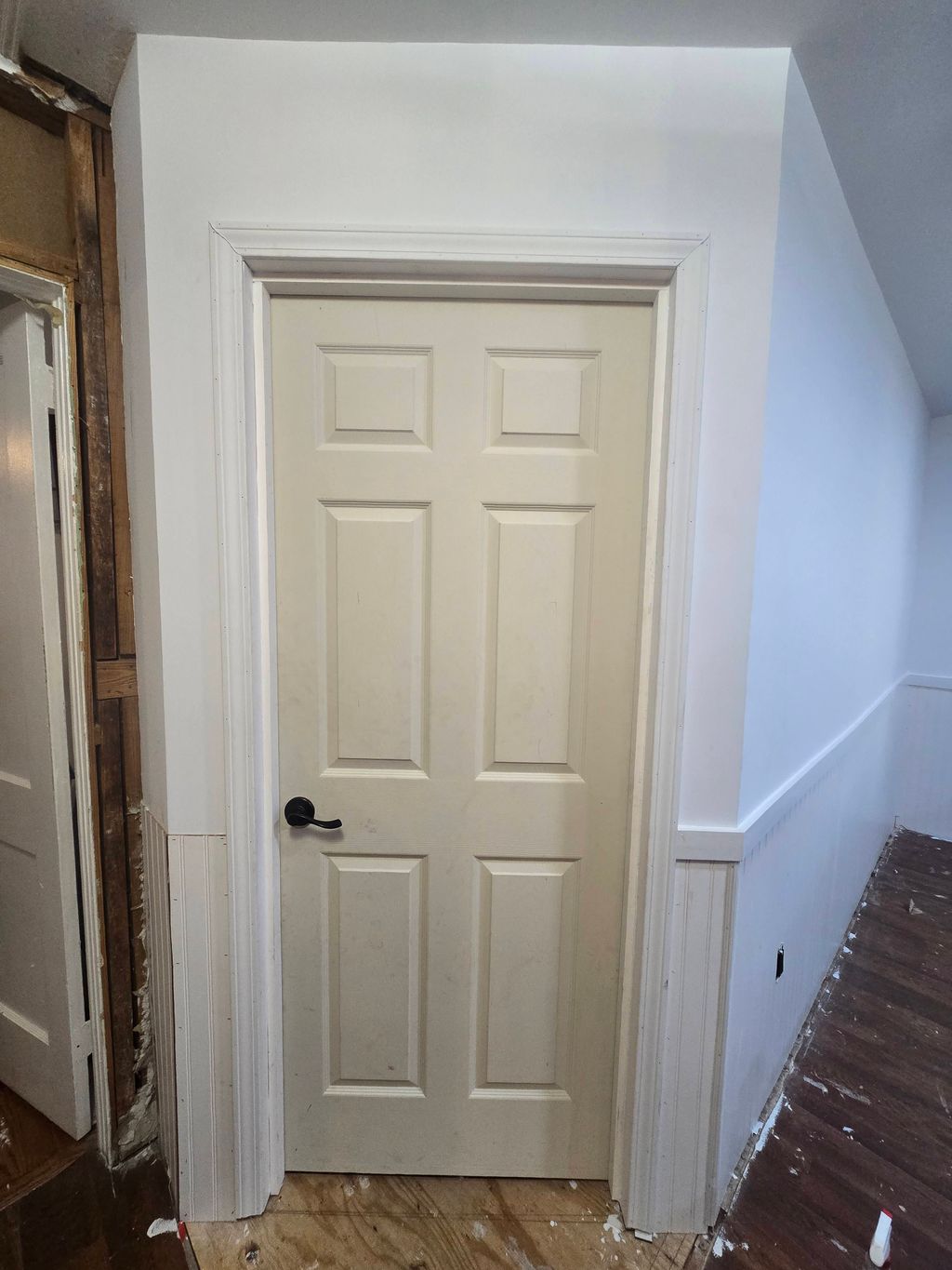 Beveled wall and new door install. 