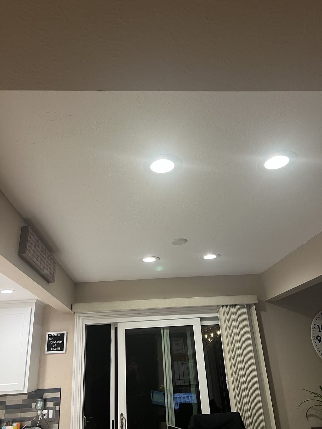 Removed hanging light, installed four can lights.