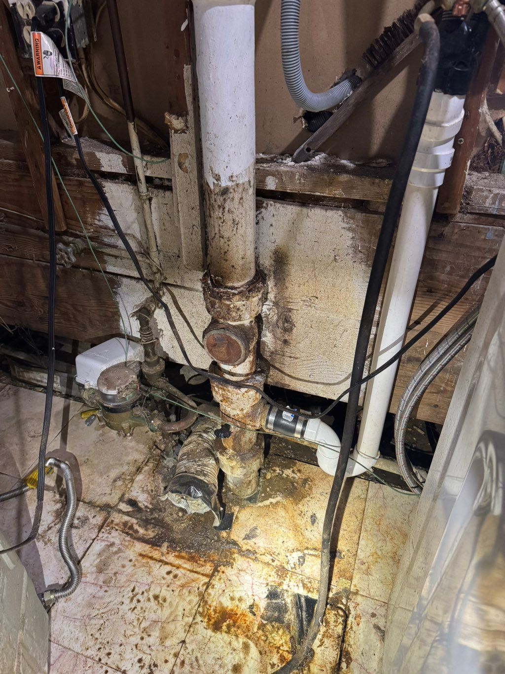 Corroded clean out tee was cracked and leaking fro