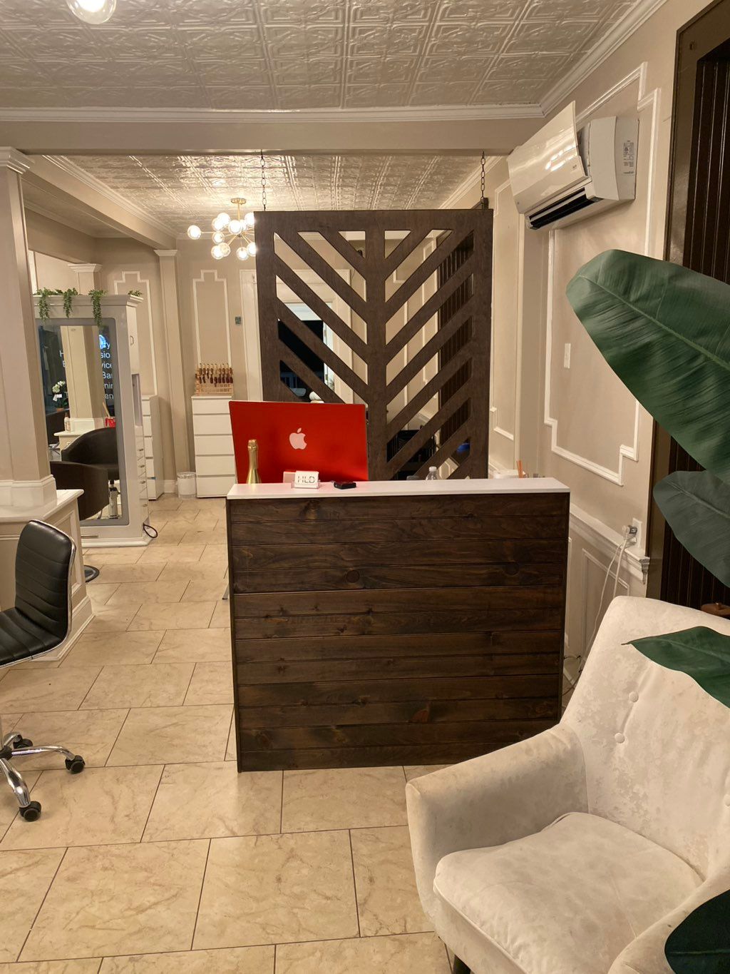 Both the reception desk and hanging piece stains i