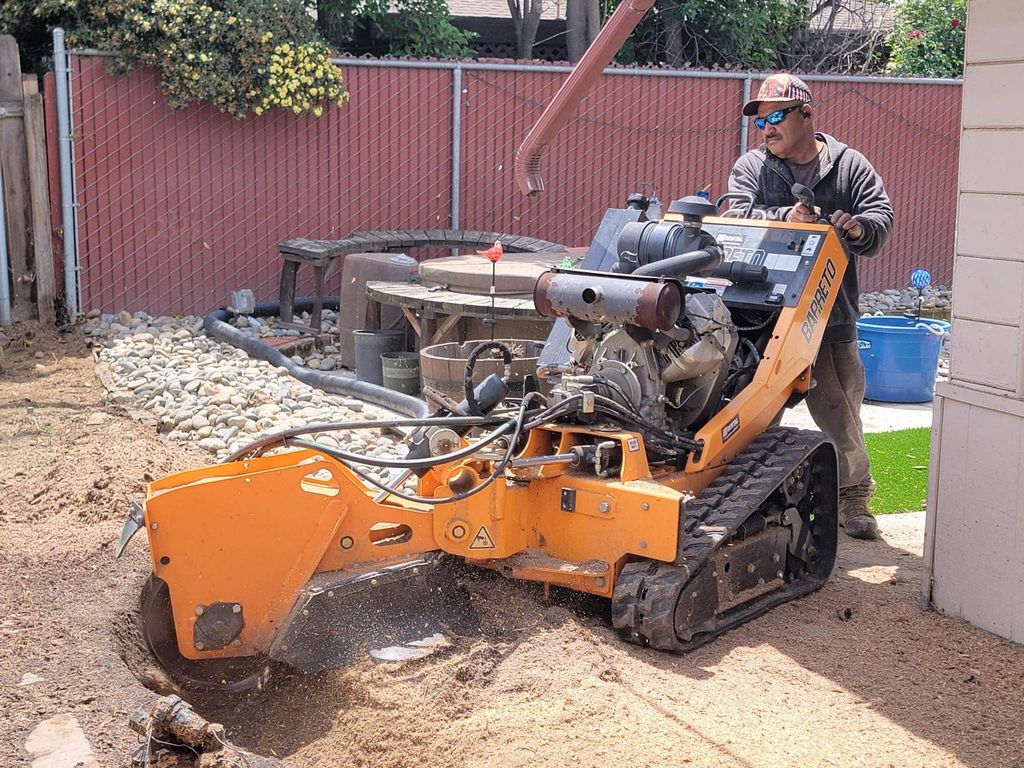 Stump grinding for a fence installation.