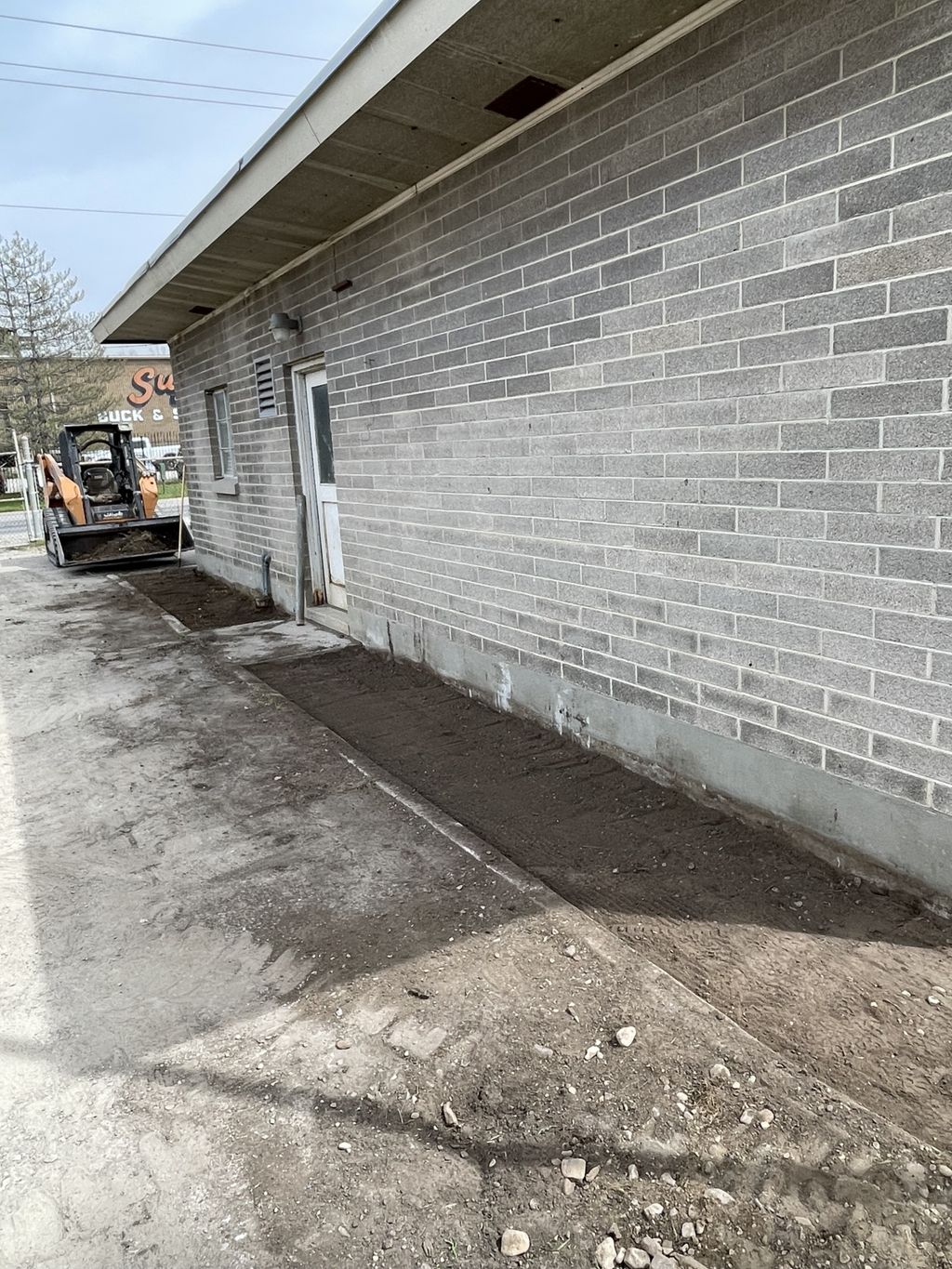 After. Trash and debris removal, final grade, and 