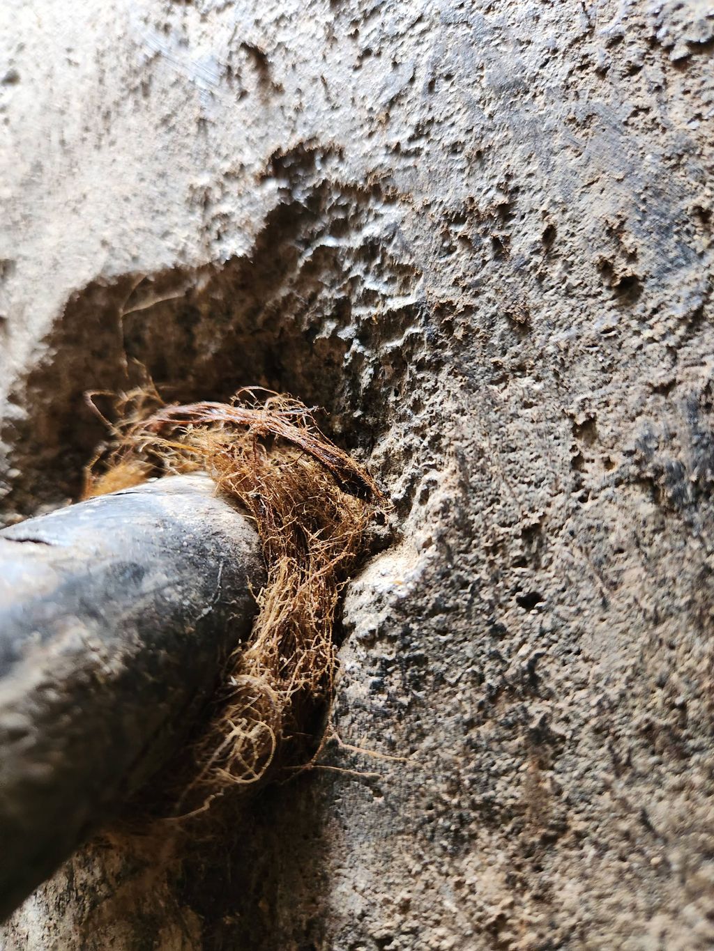 oakum packed around water service line 