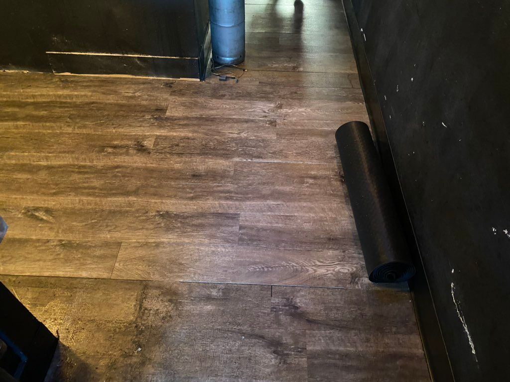 Replaced flooring in a bar in downtown COS