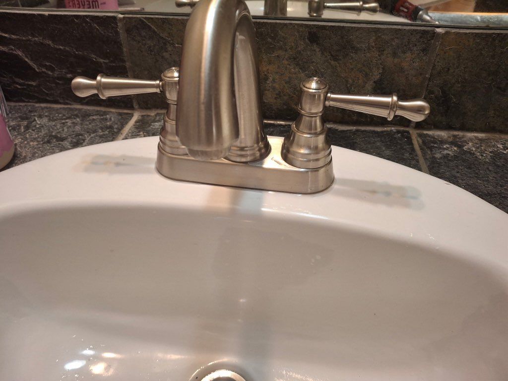 Before- lav faucet left cartridge failed 