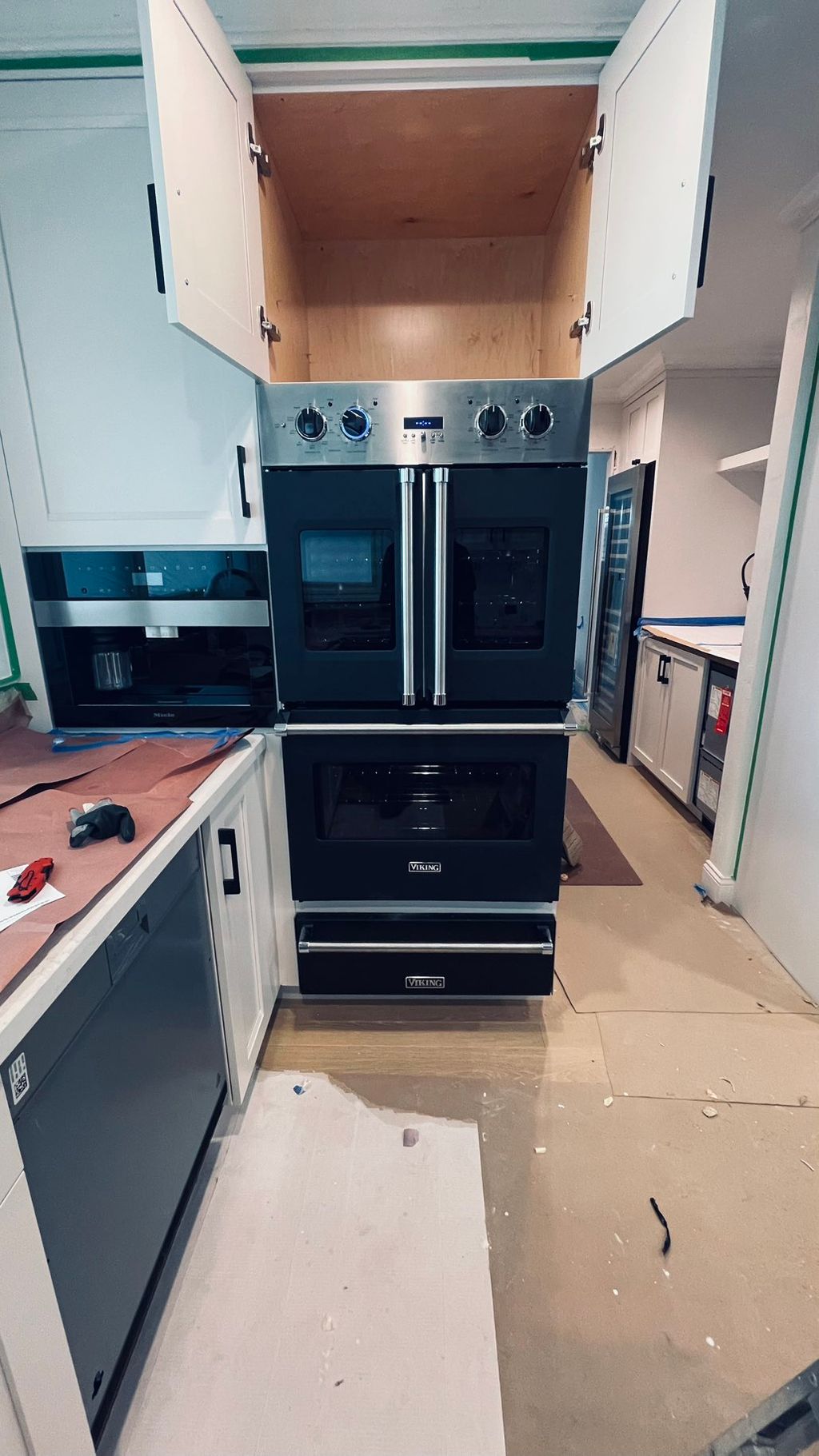 Installation of coffe make . Double oven and warmi