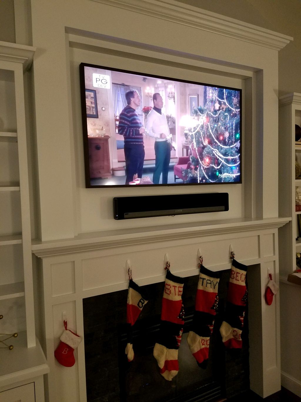 Television and soundbar mounting over a fireplace