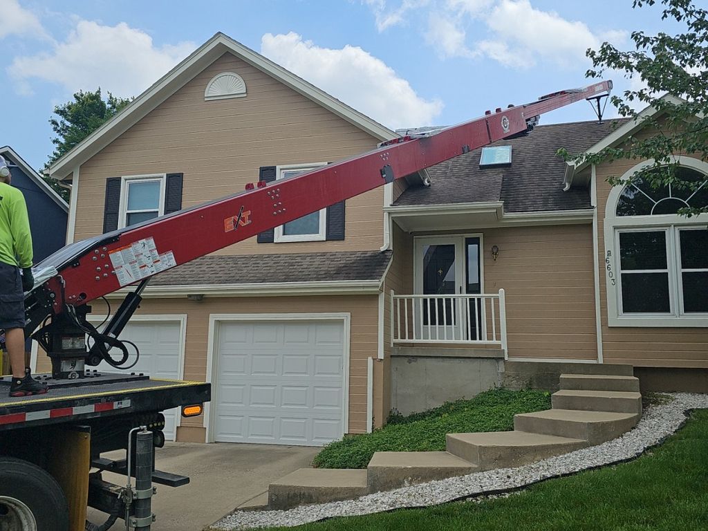Roof load day—PCS crews use boom delivery for effi