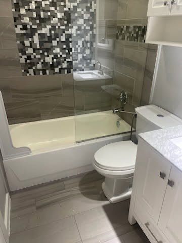 Replaced toilet. Add splash guard to tub.