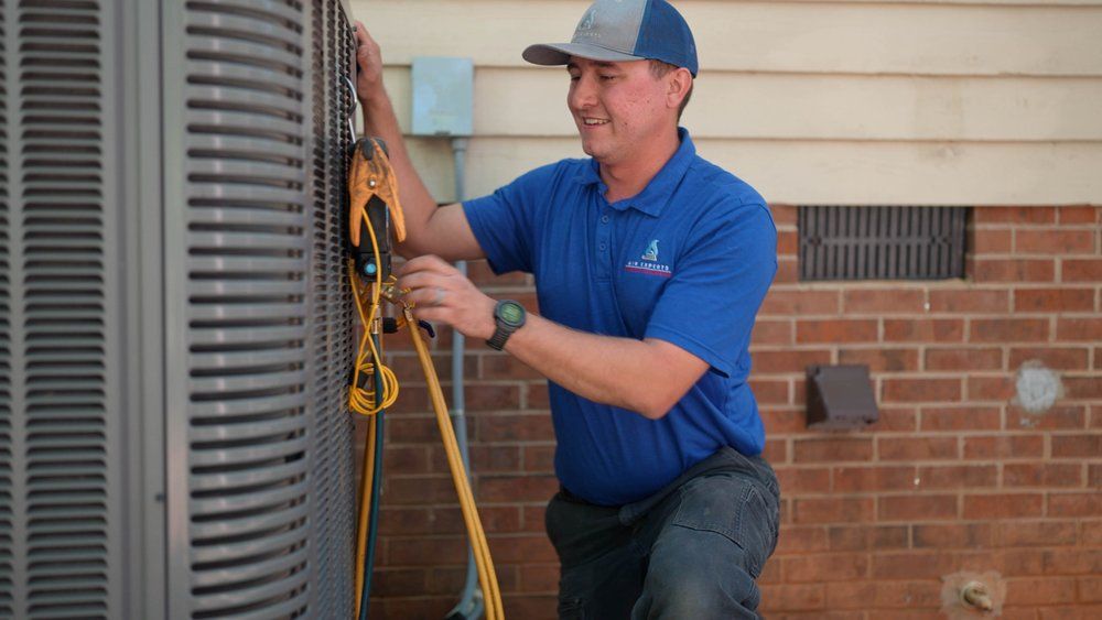 One of our techs performing AC maintenance.