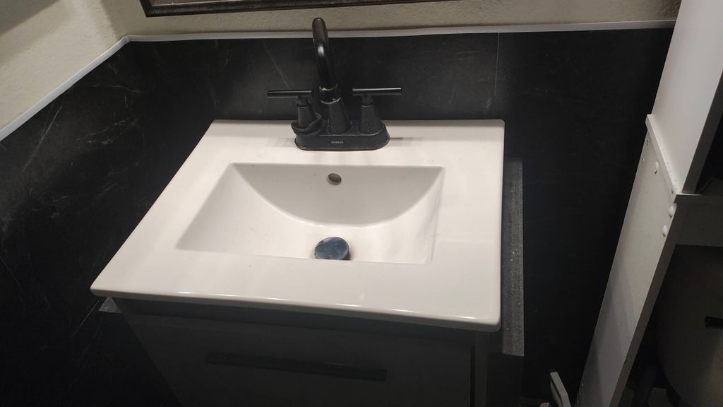 removed old sink and mounted new floating sink