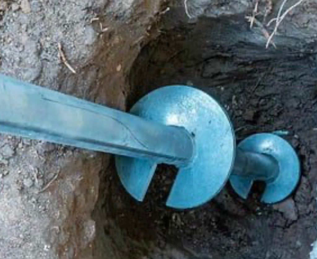 Galvanized Steel Helical Torque Anchor Being Drill