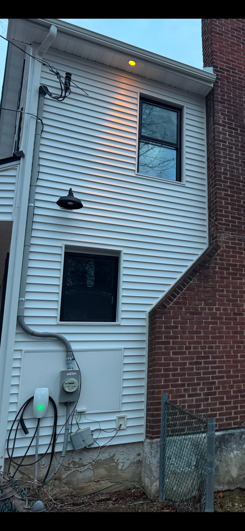 Recessed lights in soffit and wall light installed