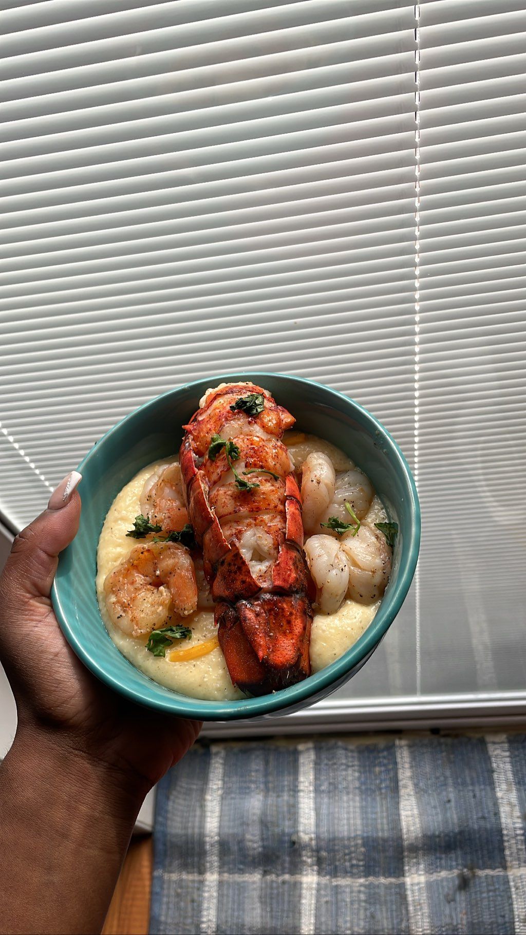 plated menu: cheesy seafood grits with charbroiled