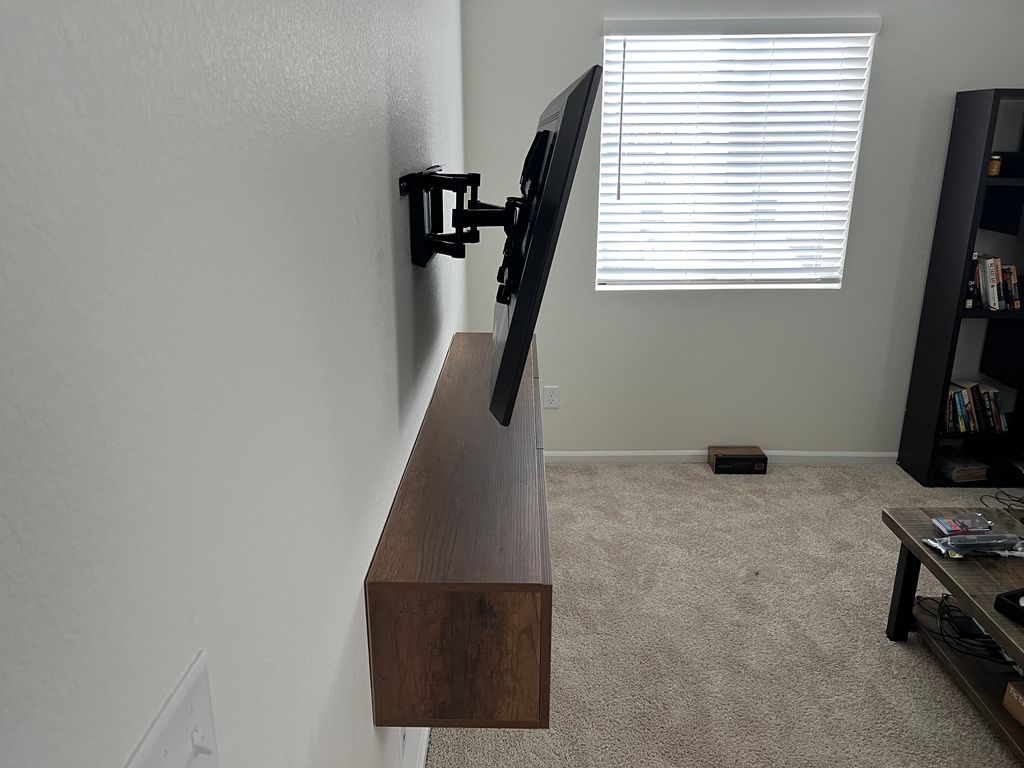 Install floating shelf and TV