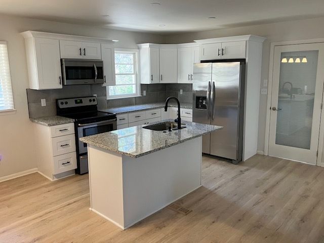 Kitchen remodel: moved mechanicals, re framed and 