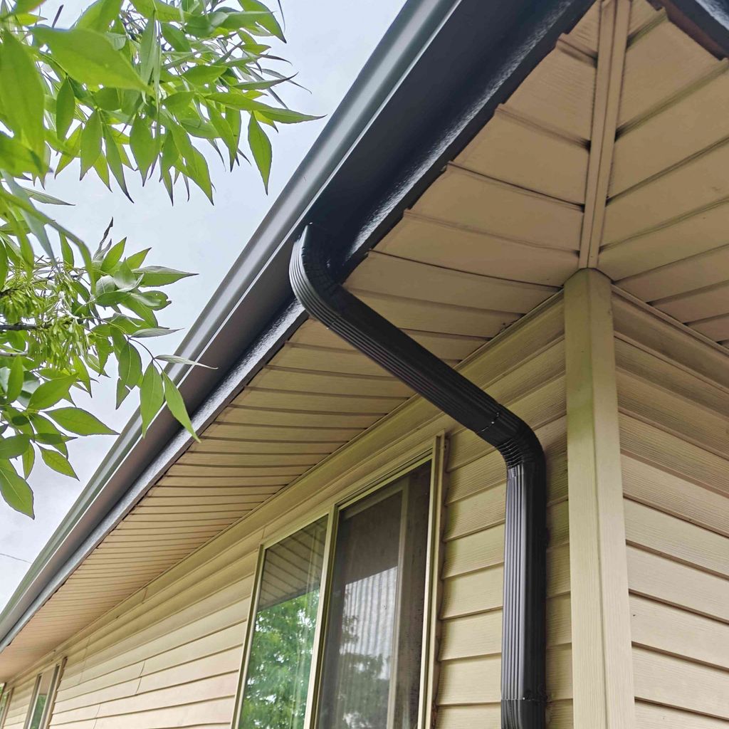 5-inch Black gutters and downspouts installed in A