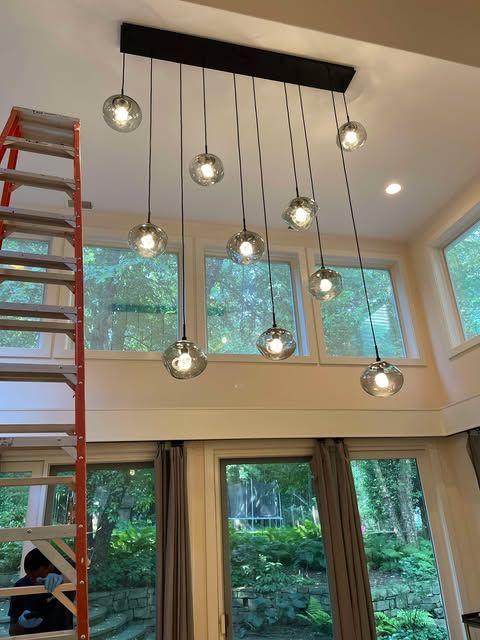 2 Story ft Ceiling. Crystal light fixture, 100 lbs
