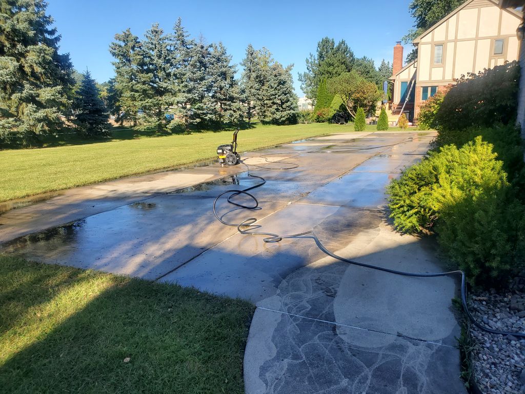 Pressure Washing in Progress - Backyard
