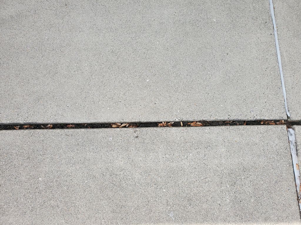 Pressure washed concrete before joint sealing
