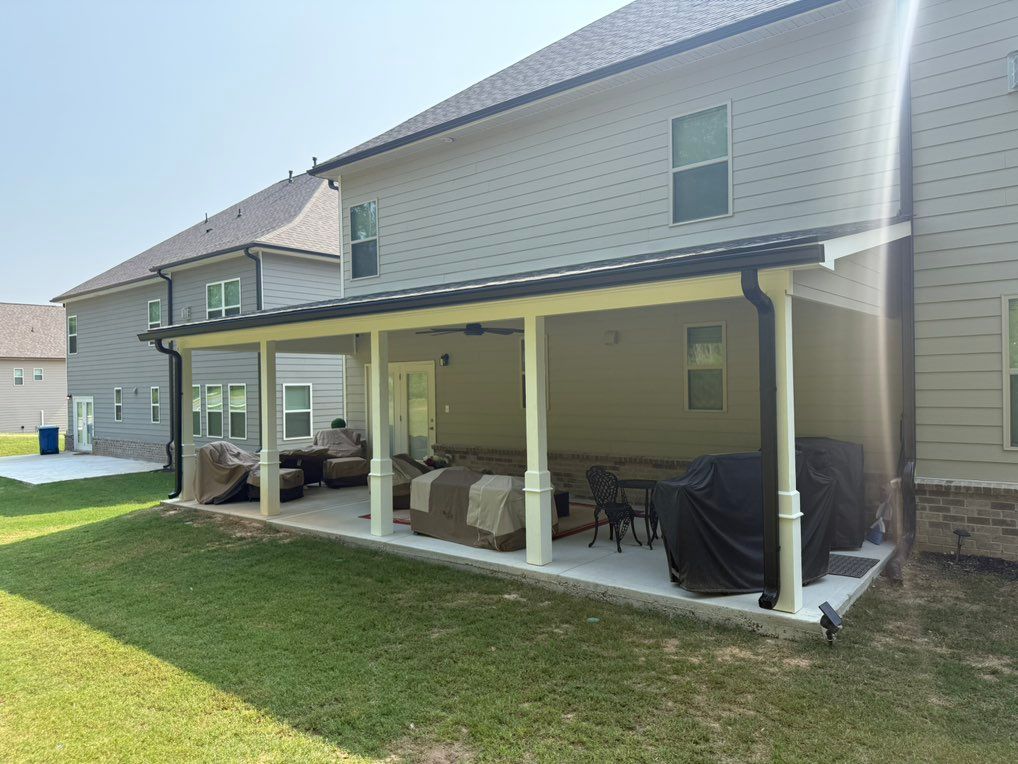 After with new 6 inch black gutters 