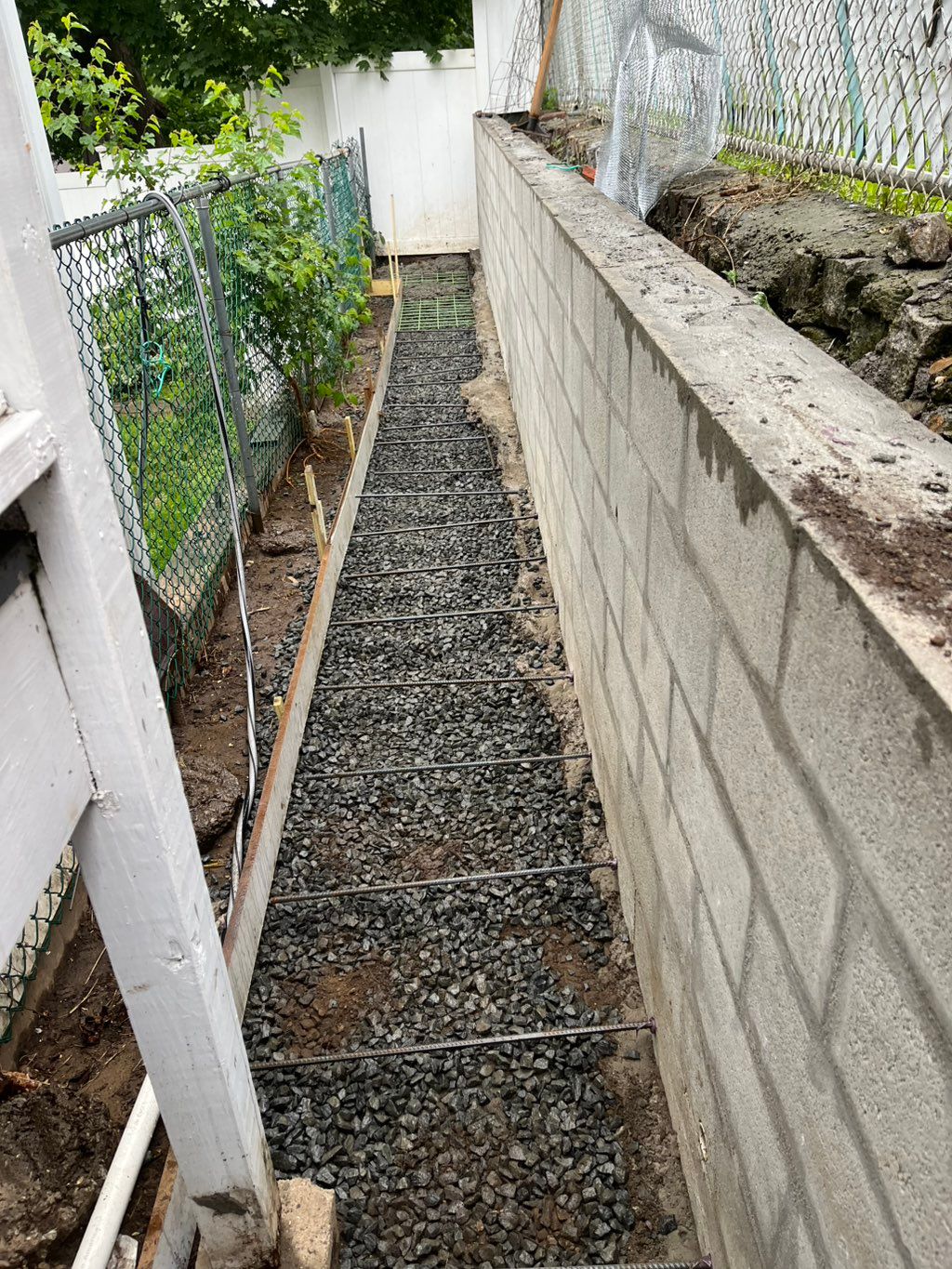 After retaining wall was built we poured a concret