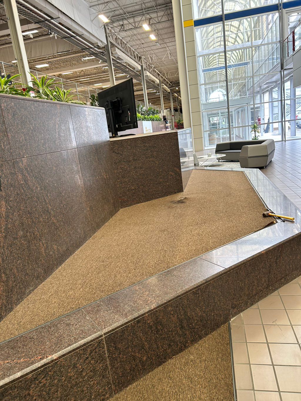 The playwood under the carpet was rotting, the cus