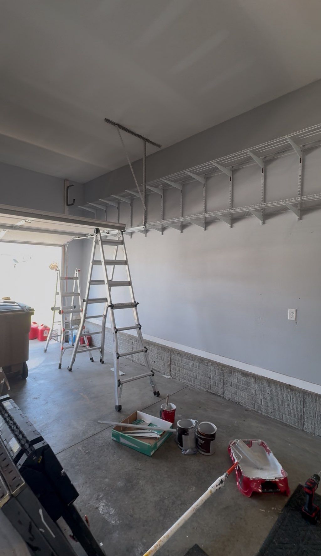 Painted garage walls and installed shelving 