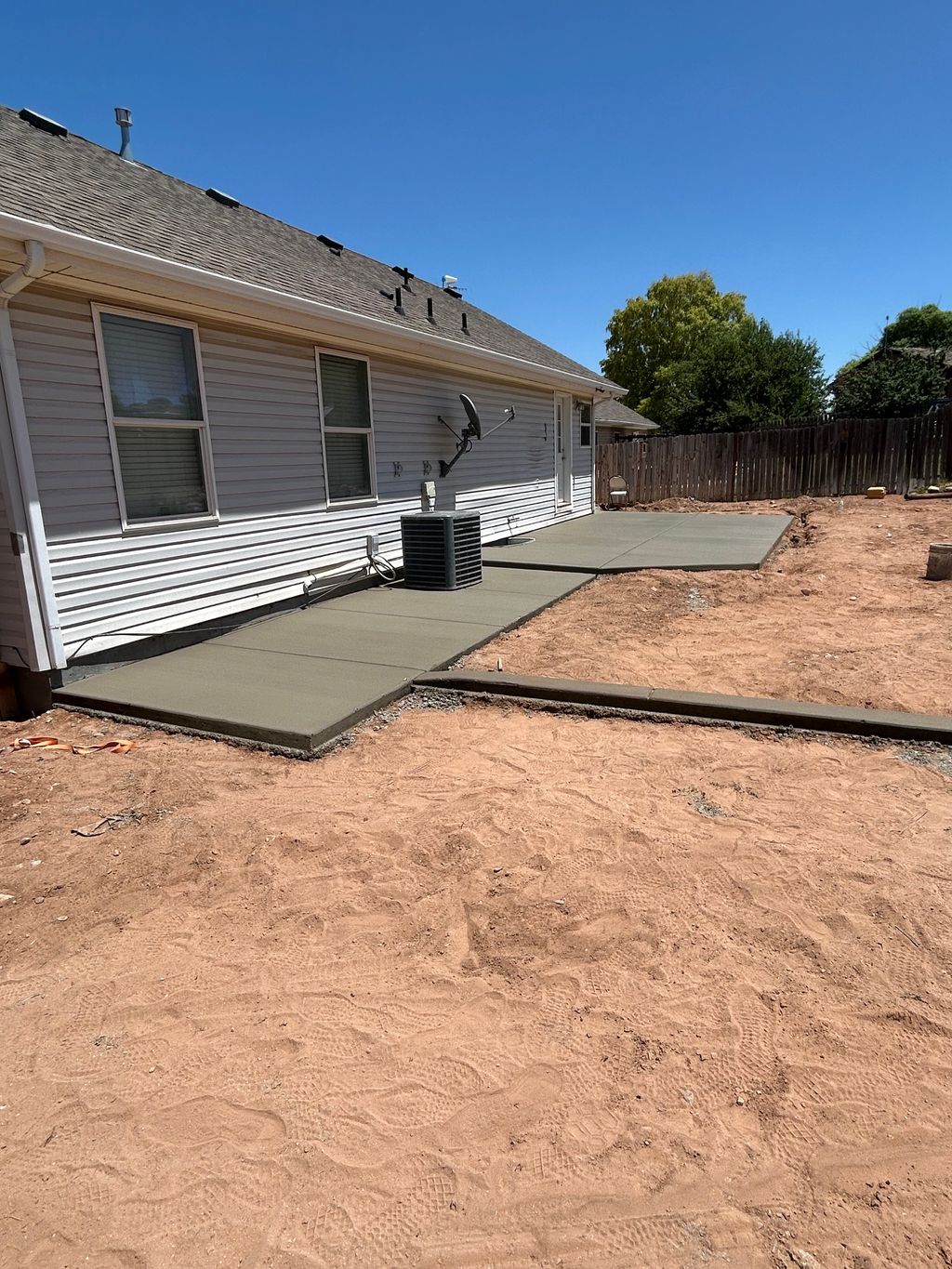 Vernal patio, sidewalk, and curb wall
