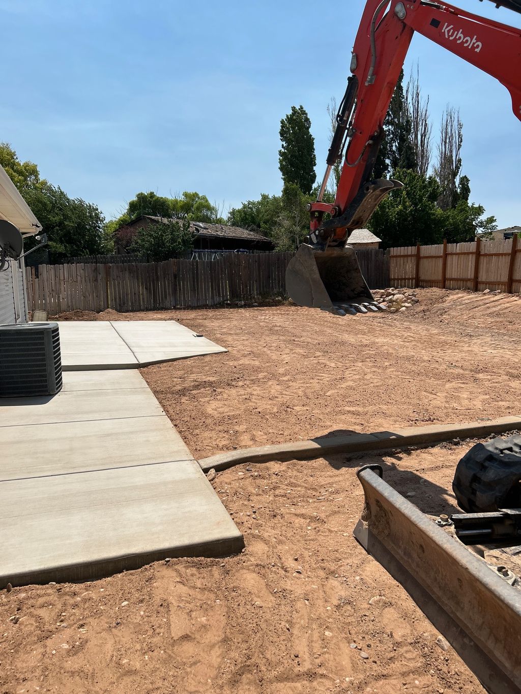 Vernal patio, sidewalk, and curb wall