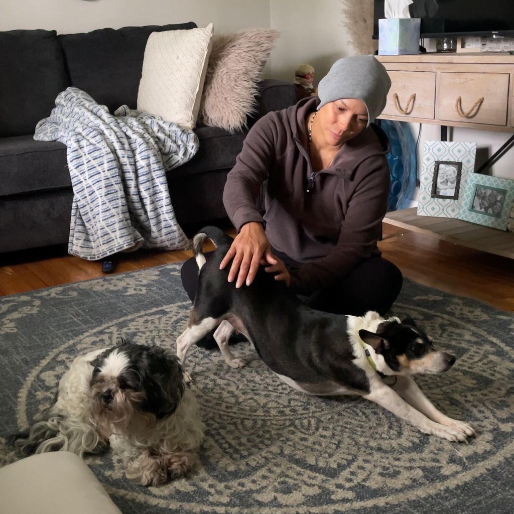 Vinny stretching his hips during a pet reiki sessi