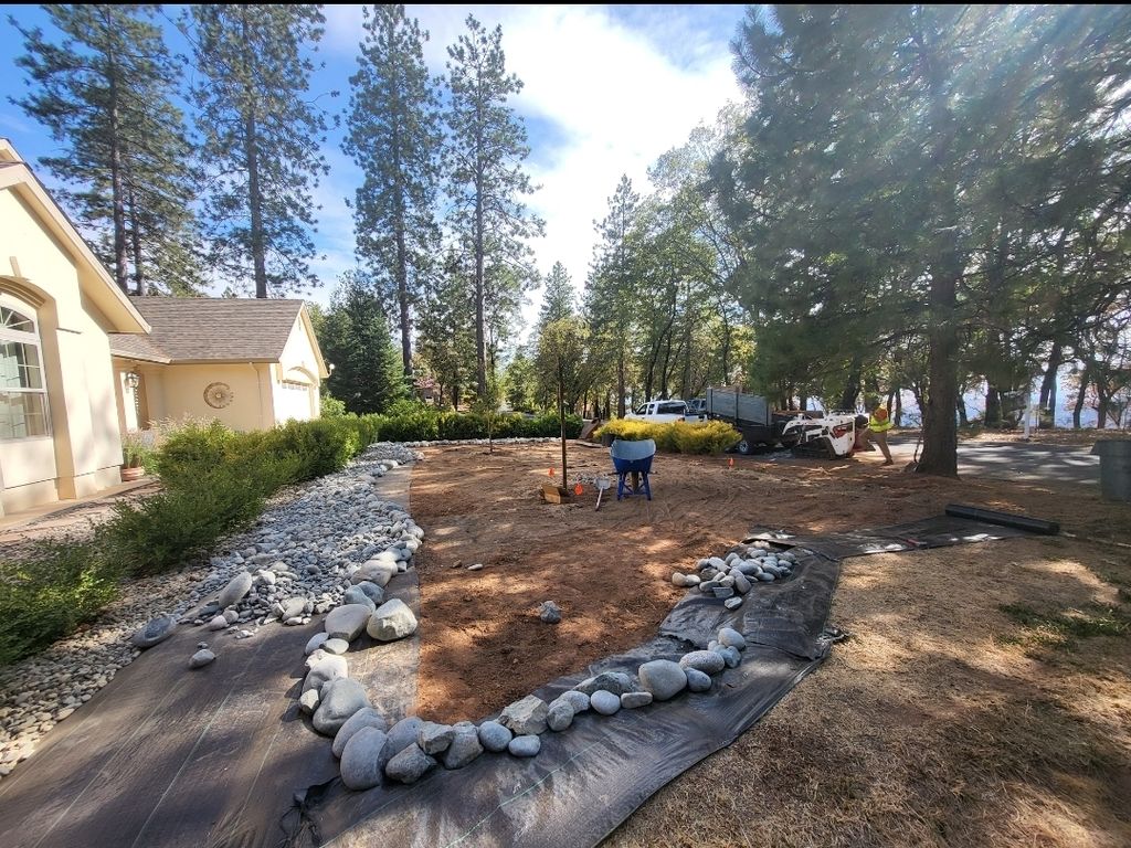 We converted this lawn to a rock landscape with de