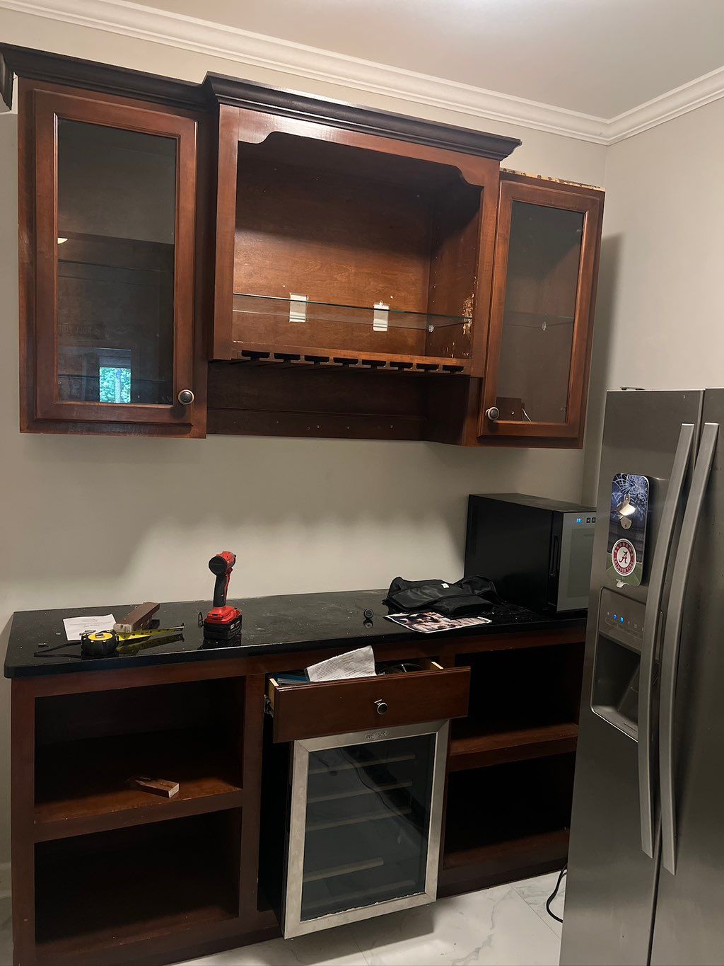 From a small out cove with a refrigerator to a bar