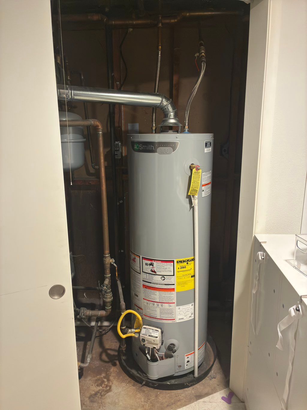 Natural gas water heater being swapped with a powe