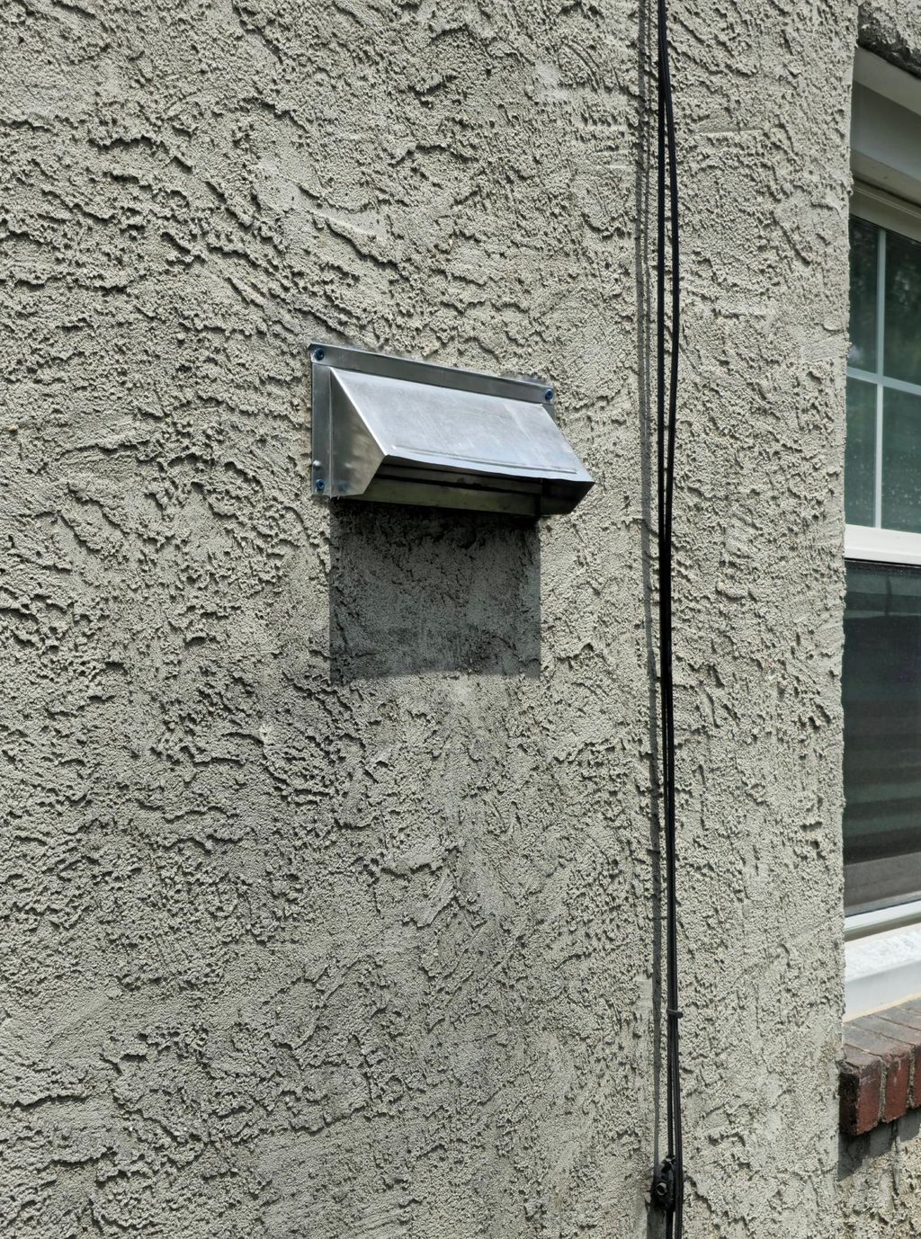installing microwave exhaust hood in stone wall